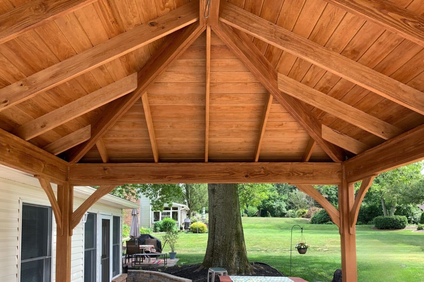 view of ceiling and trusses under lakefront pavilion