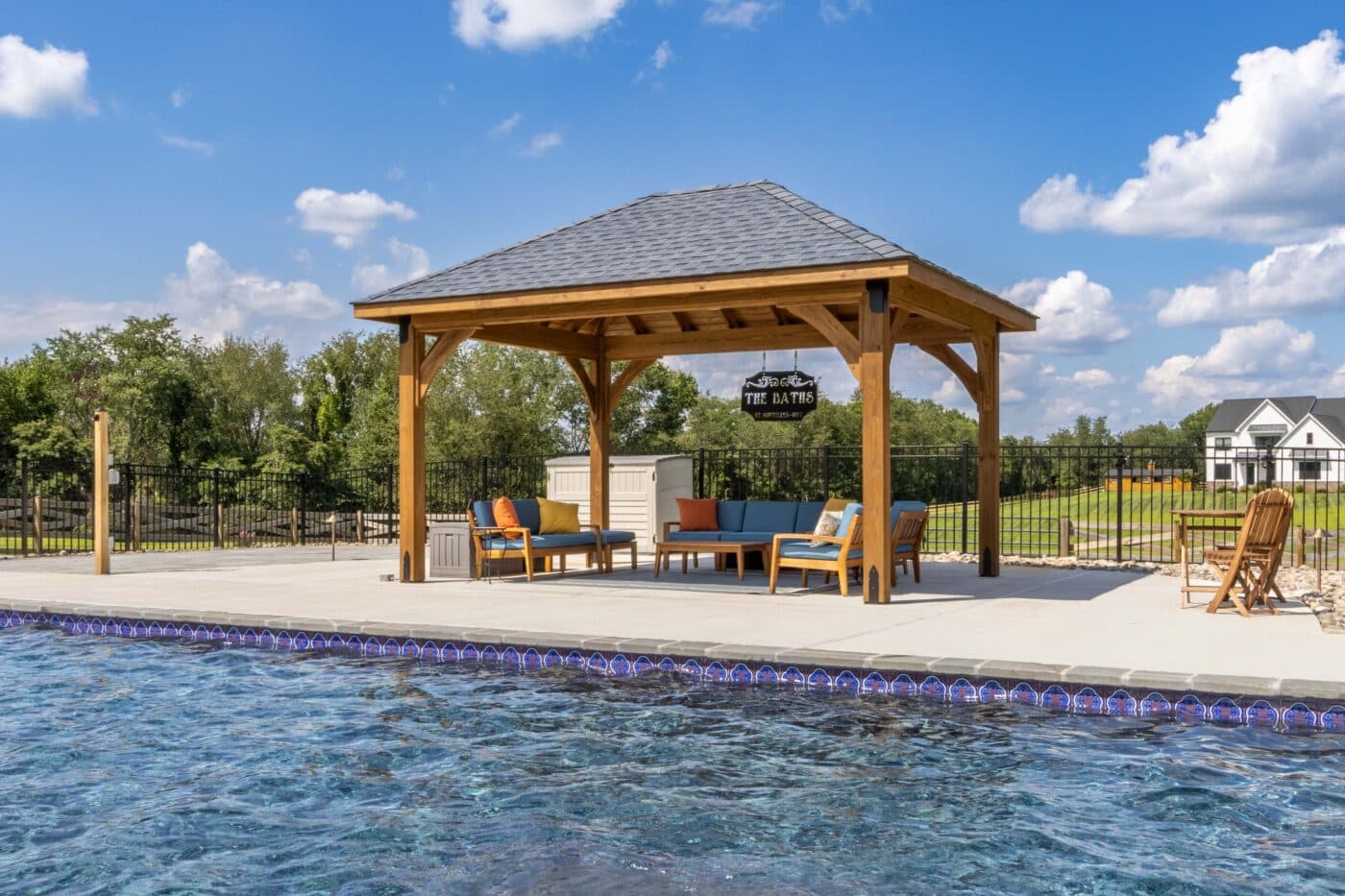 View of 12x16 Cheyenne wooden pavilion across from pool