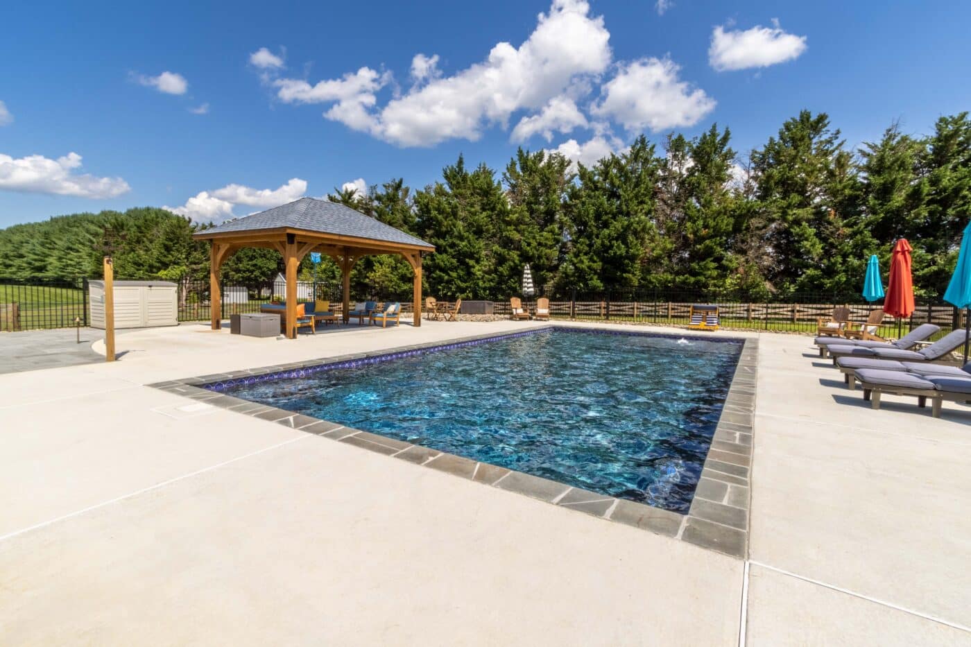 View of 12x16 Cheyenne Wood Pavilion from across the pool