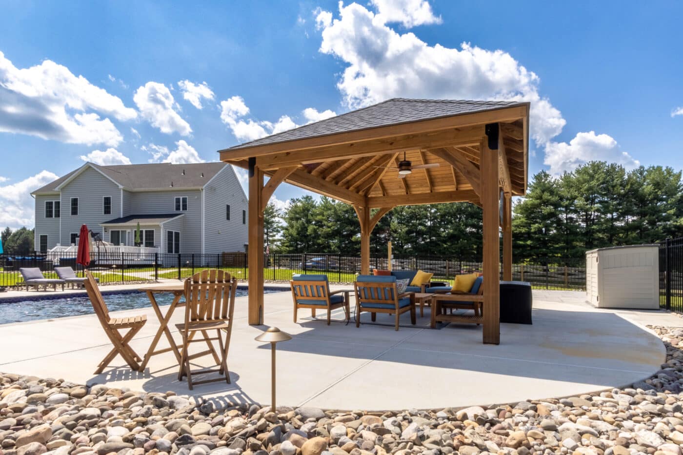 Side view of 12x16 Cheyenne Wood Pavilion with seating area