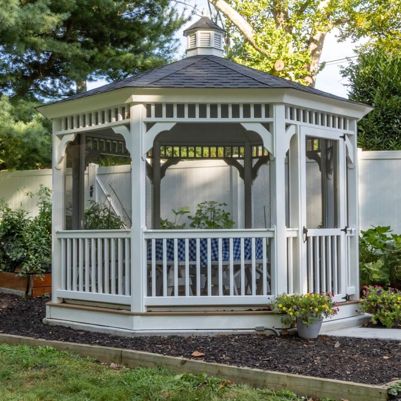 View of rails on vinyl octagon gazebo in garden under shade
