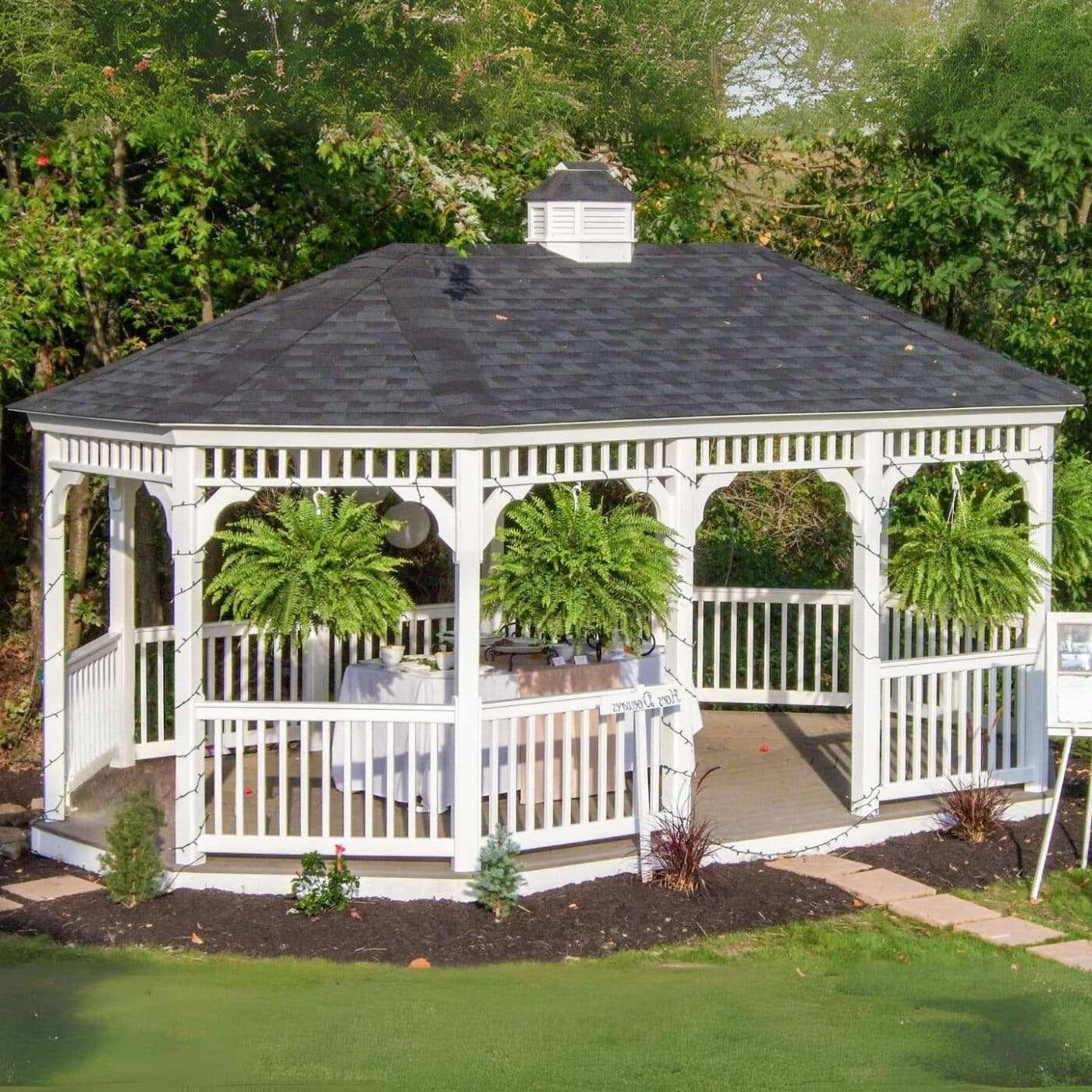 The Vinyl Oval Gazebo 2 View of vinyl oval gazebo with decoration in garden