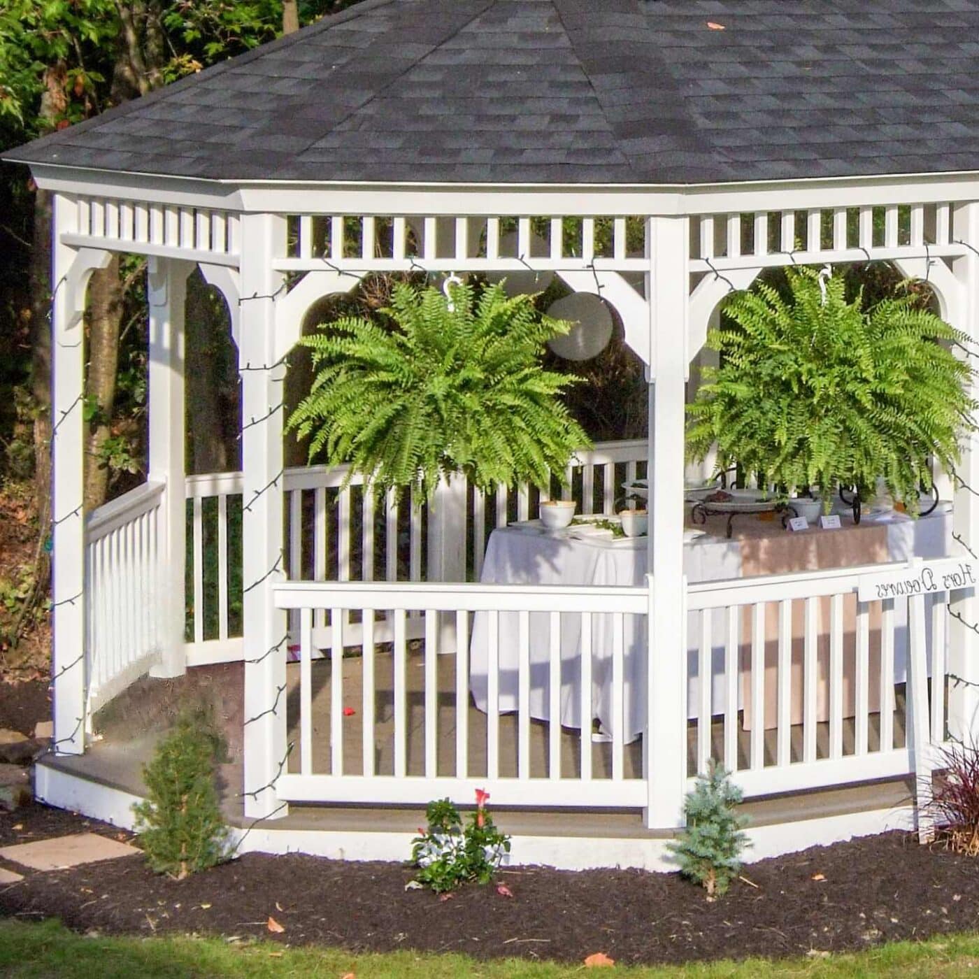 The Vinyl Oval Gazebo 5 Rails on vinyl oval gazebo with plants and lights on gazebo