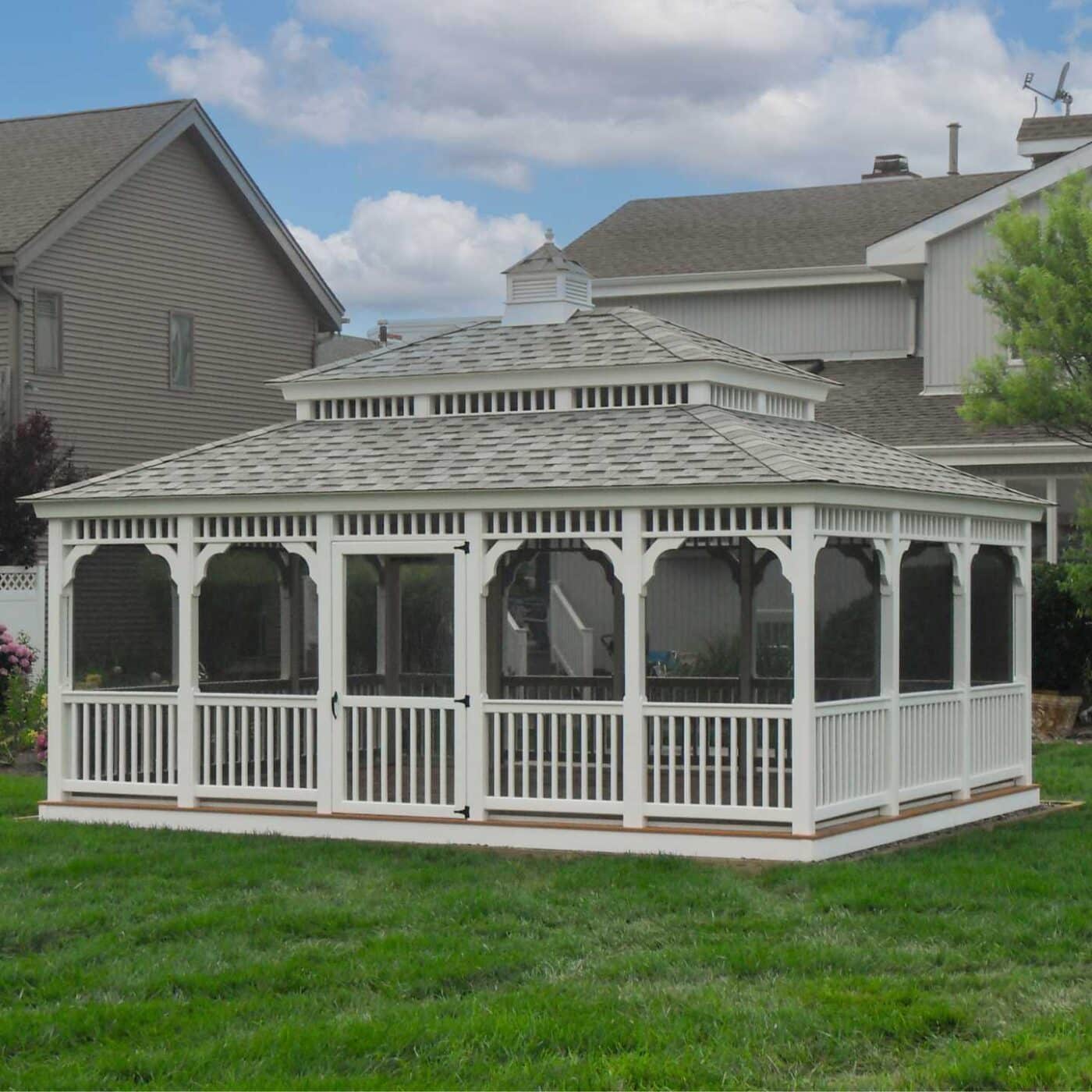 Double roof on vinyl rectangle gazebo with screened in porch and door