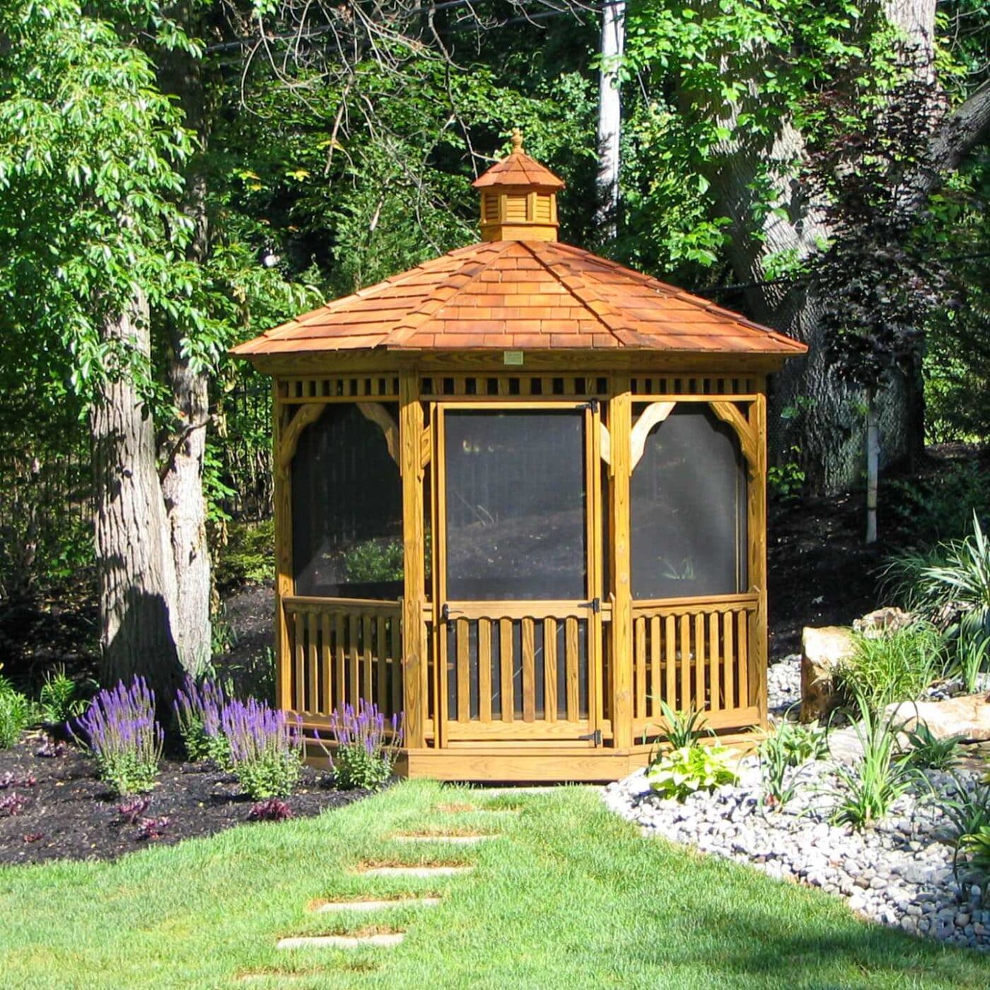 The Wood Octagon Gazebo 2 Screened in wood octagon gazebo in garden with cupola