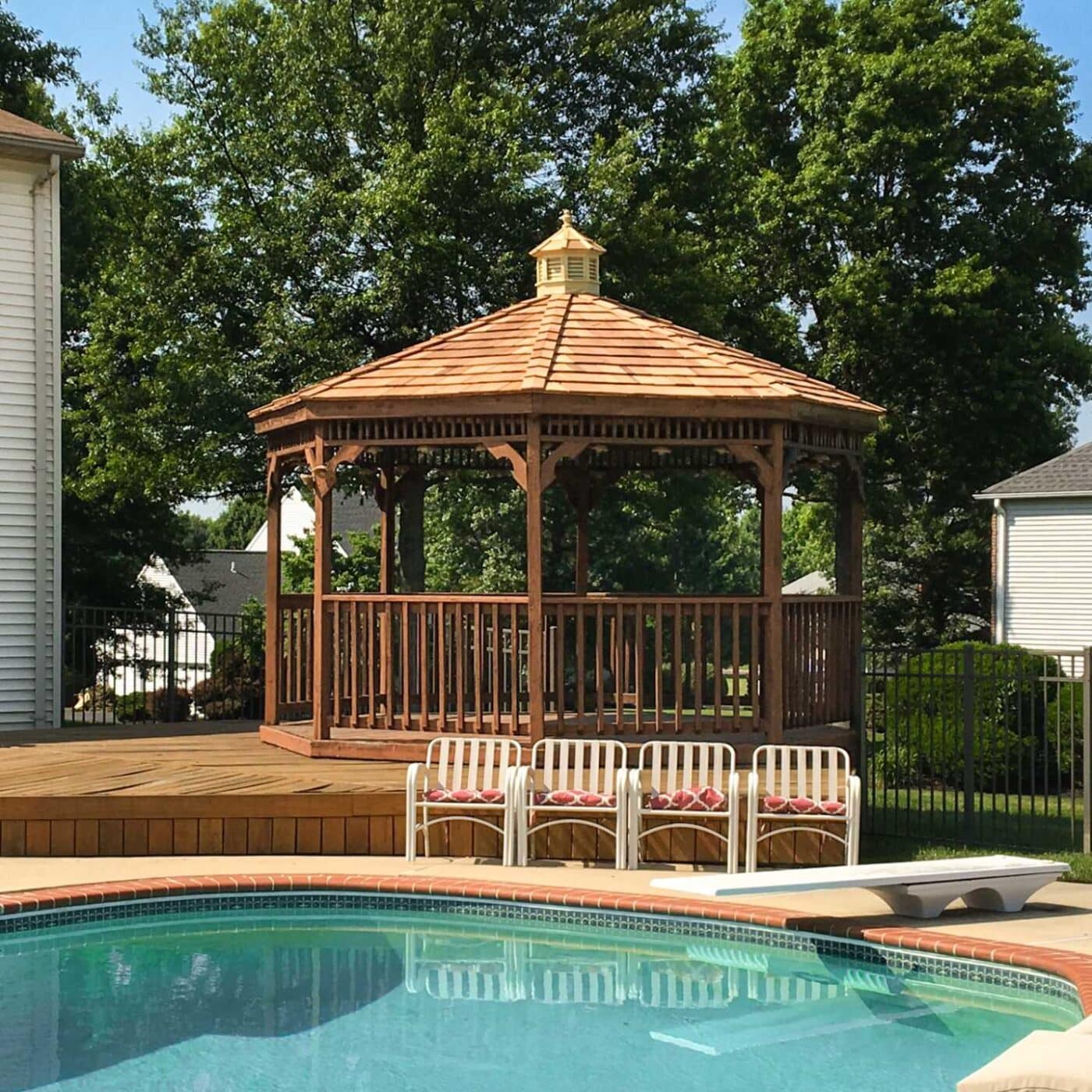 The Wood Octagon Gazebo 4 View of rails on wood octagon gazebo across from pool