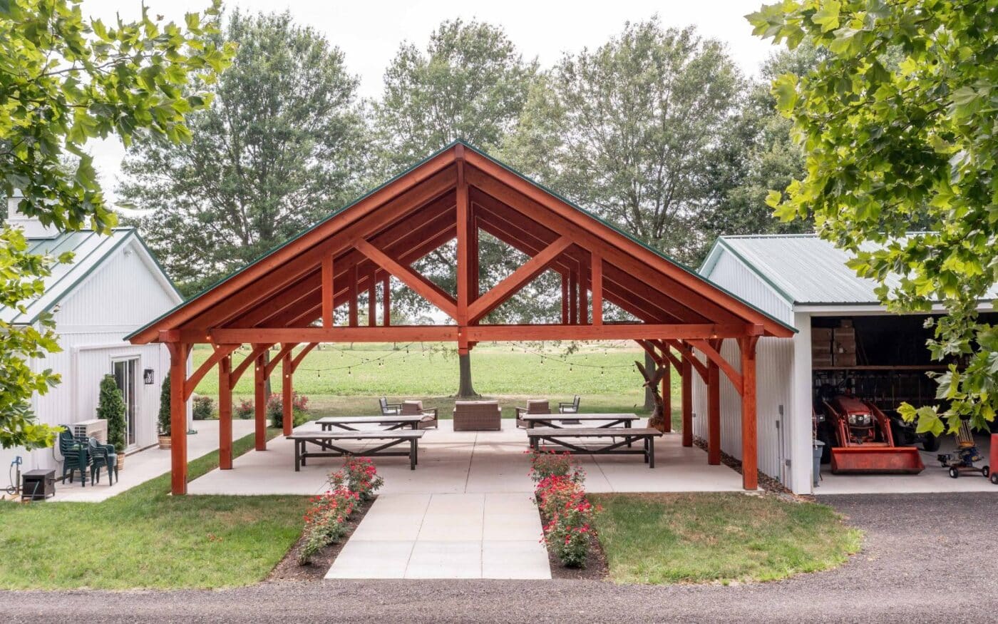 Aeriel view of front of 38x30 Kingston Pro TImber Frame pavilion between two white buildings.