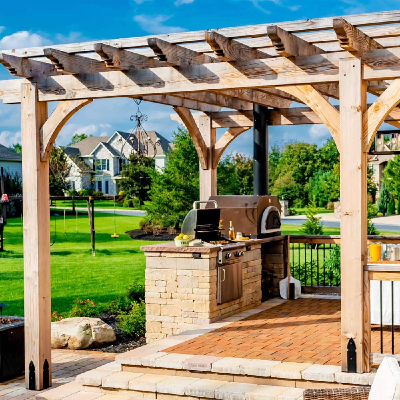 The Cherokee Pergola 3 View of Boulder's Columns, grill, and seating area