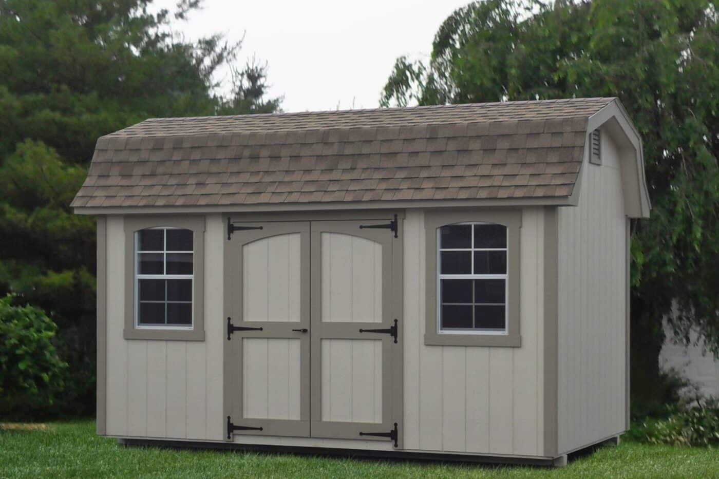 The Designer High Barn Shed 4 Designer high barn shed with wood exterior and beige siding paint and trim