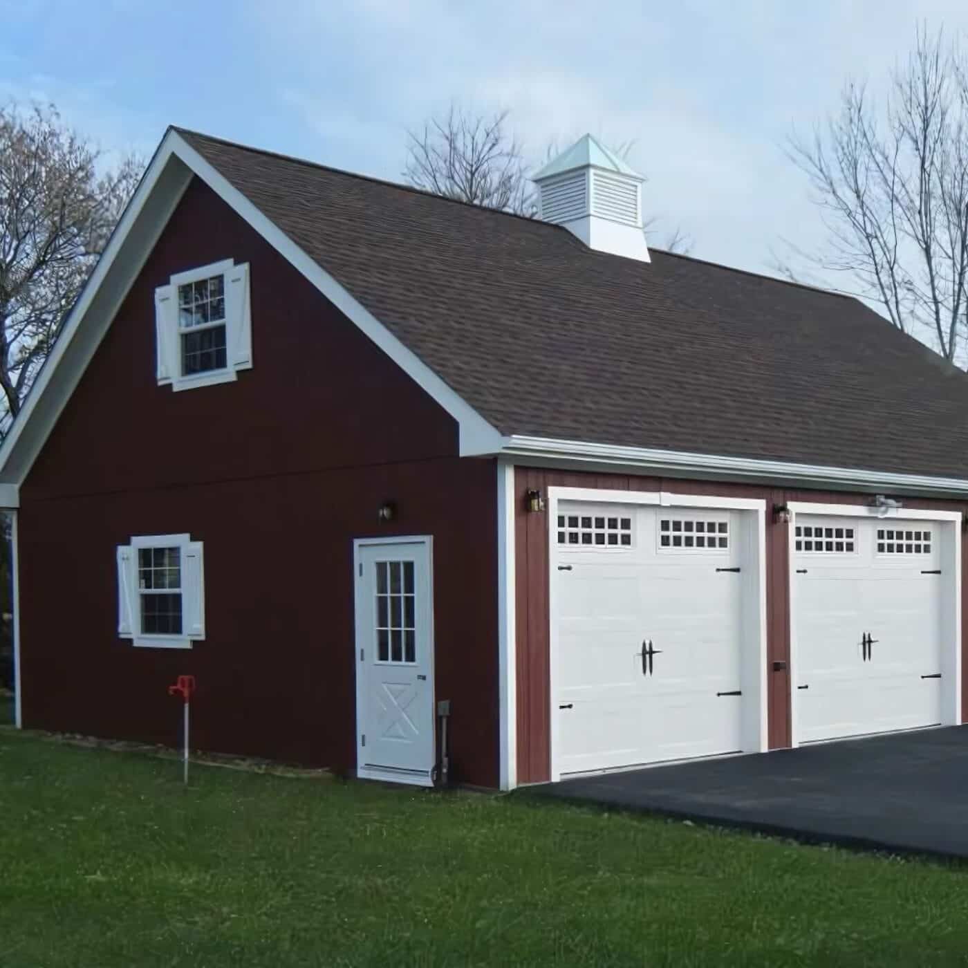 The A-Frame Attic Garage 5 Brown A-Frame Garage with white garage doors, white single door, and two windows with white shutters