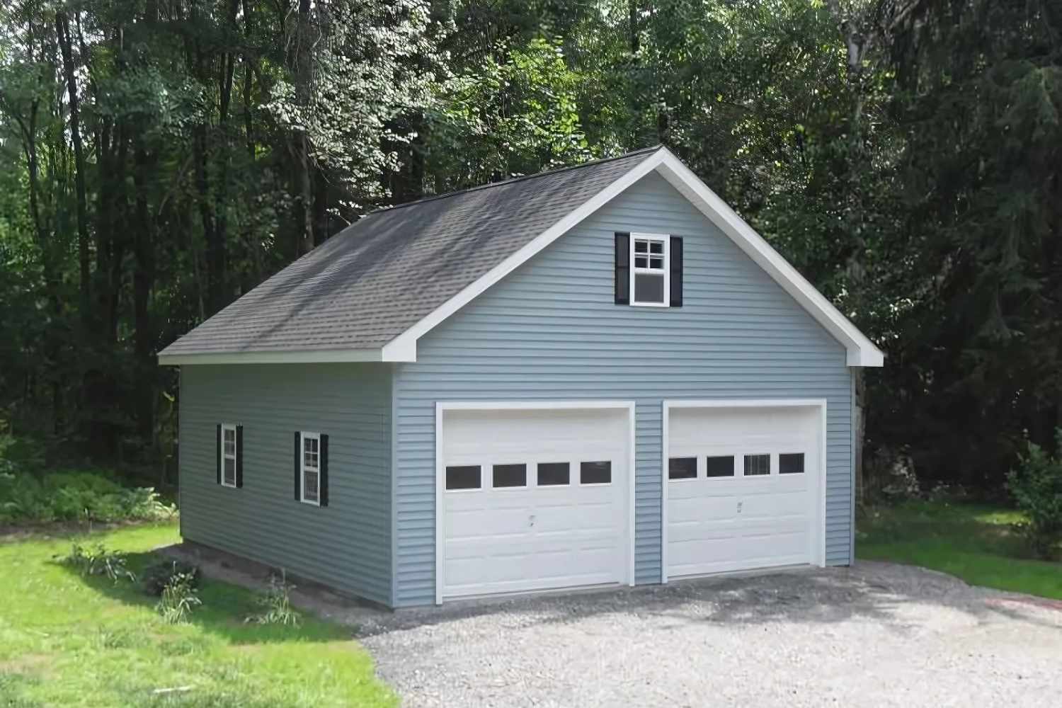 Blue garage with white garage doors and three windows with black trim