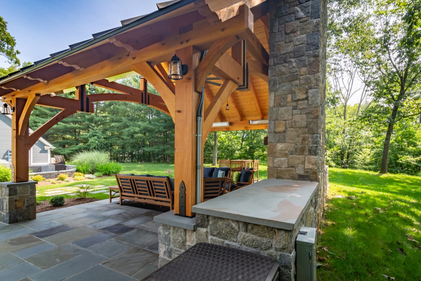 Back corner of 24x16 Timber Frame Pavilion with view of fireplace and storage space