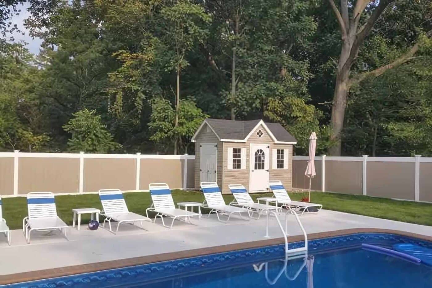 10 Creative Ways To Use A Workshop Shed (other than storage!) 1 Vinyl Cape cod shed behind pool and seating area with white trim