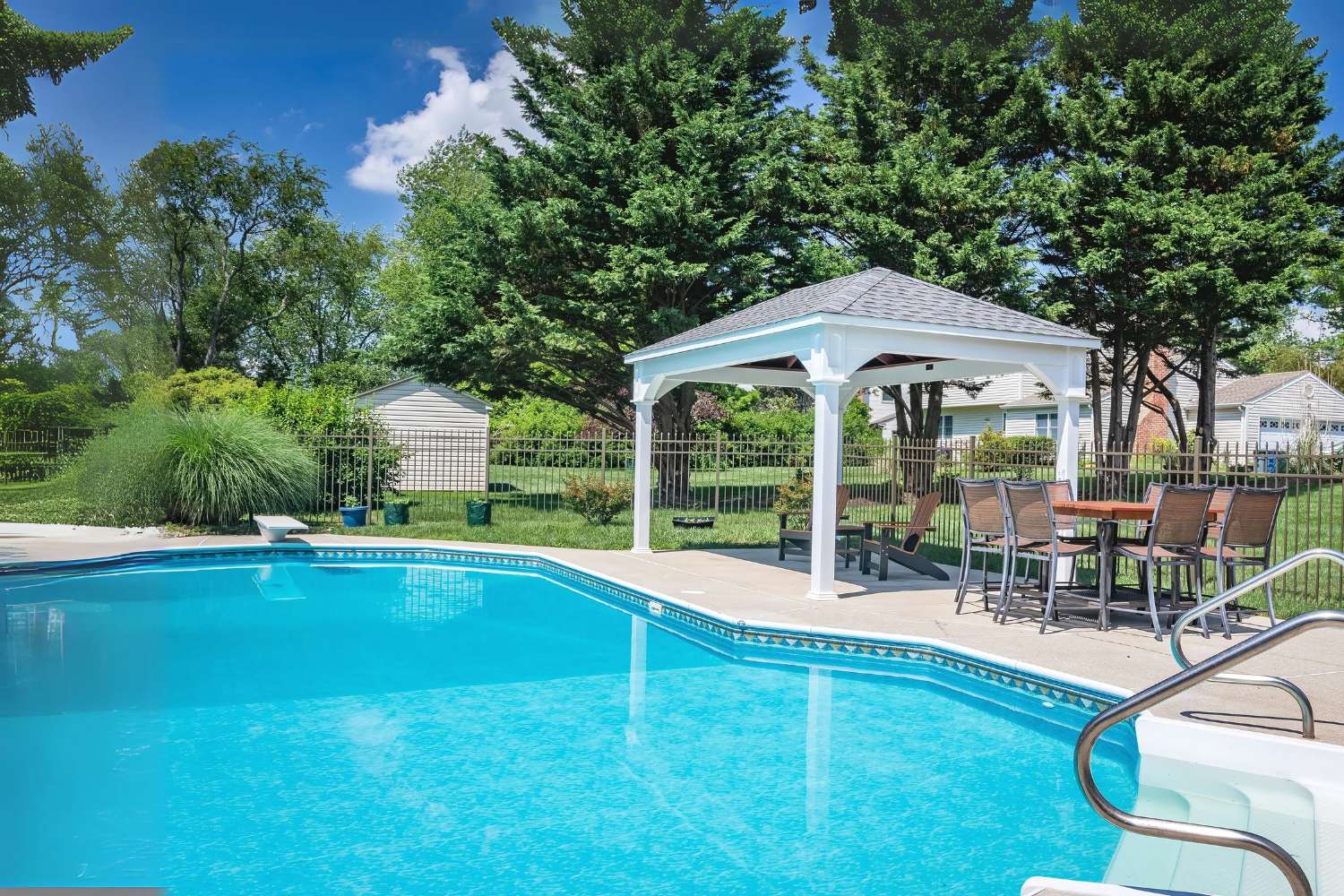 Shoreline Pavilion By Pool with seating underneath