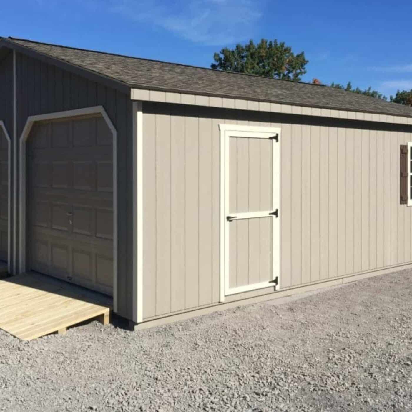 The Modular Garage 4 View of siding and trim on modular garage. Siding is gray duratemp and trim is white along single and garage door