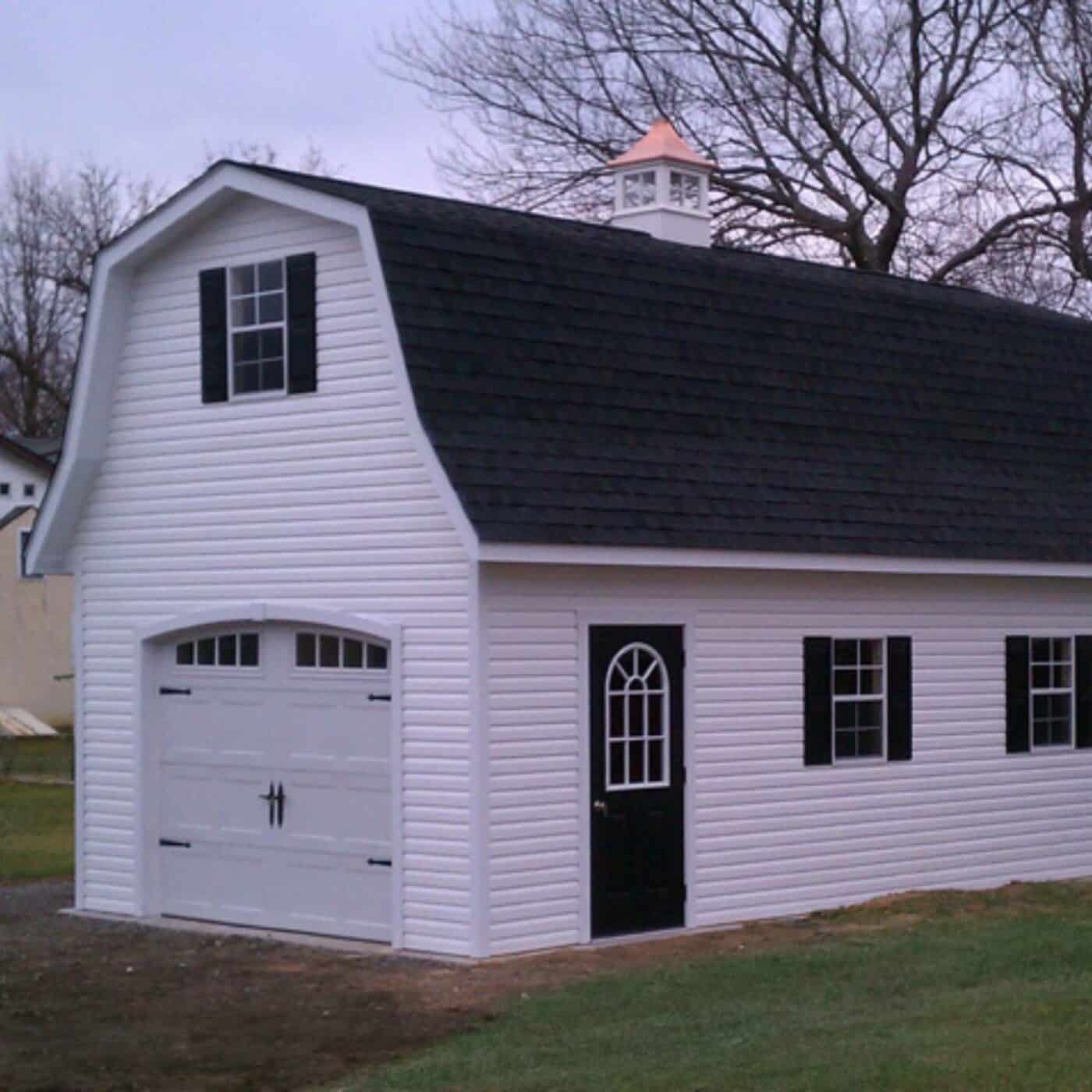 The Gambrel Garage 4 White gambrel garage with black doors, trim, and roof