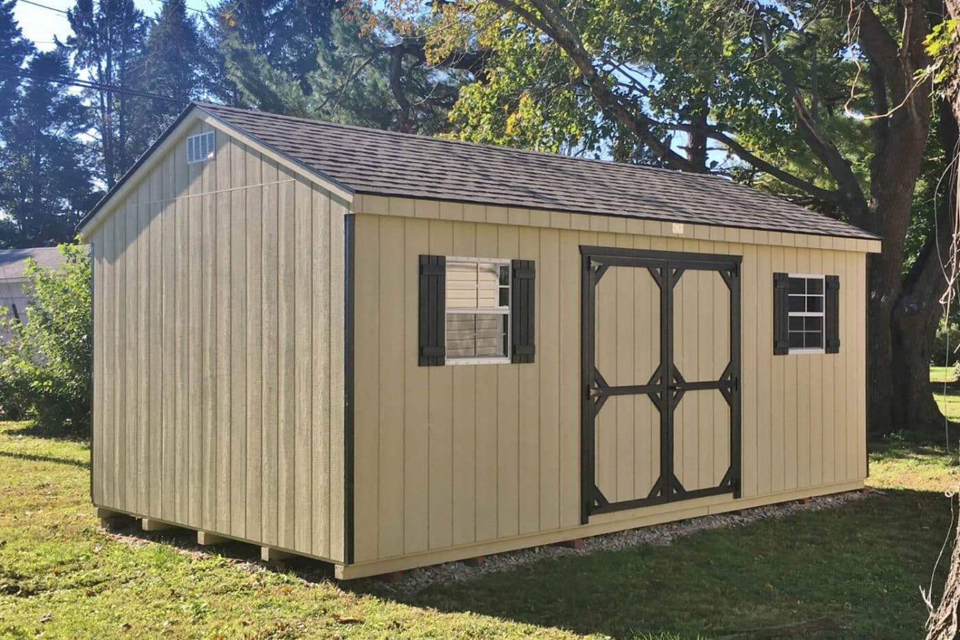 The Designer Workshop Shed 4 Standard Workshop with wood exterior in grass on sunny day