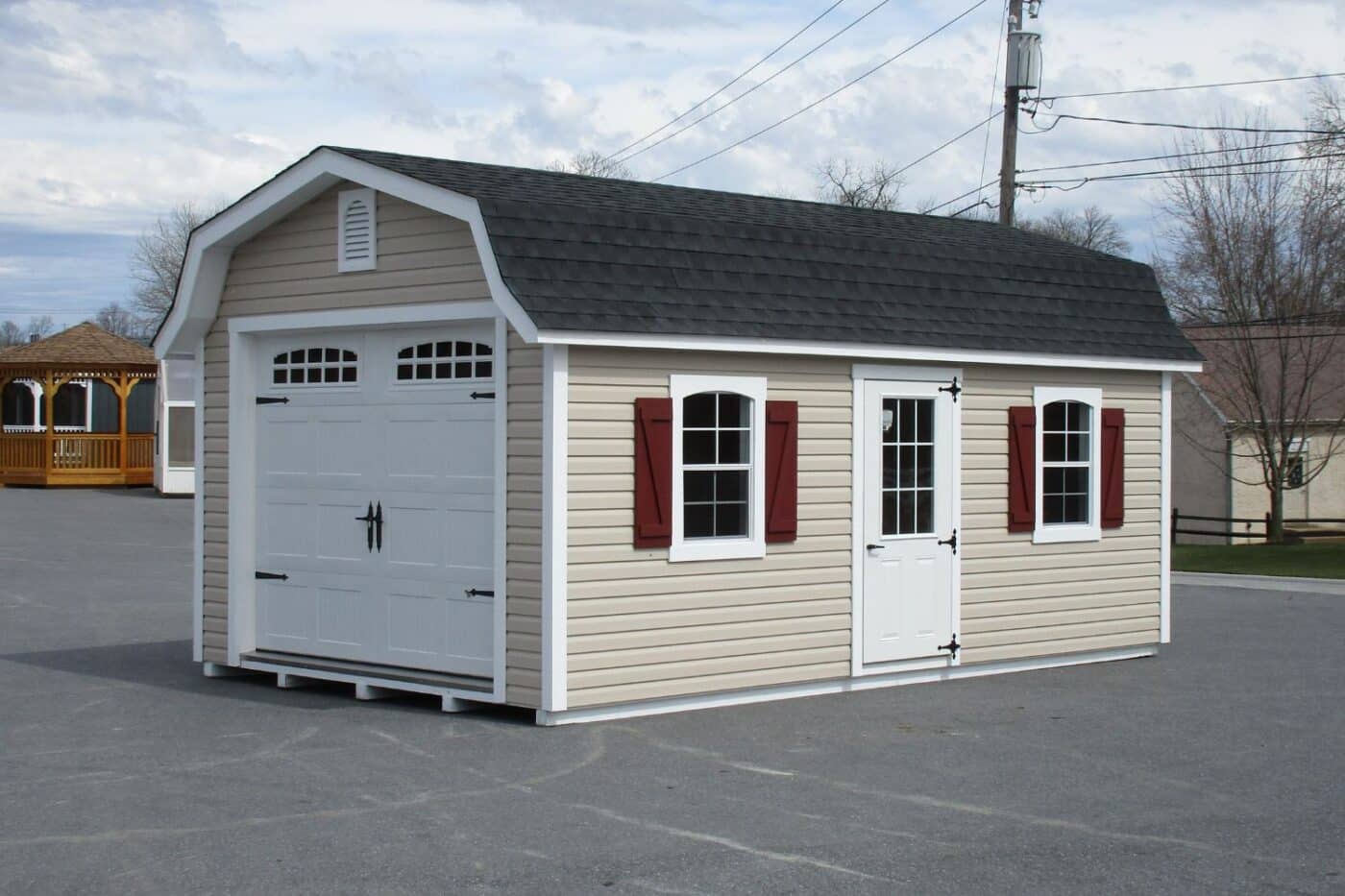 The Designer High Barn Garage 3 Beige vinyl designer high barn garage with white trim and red shutters with white doors