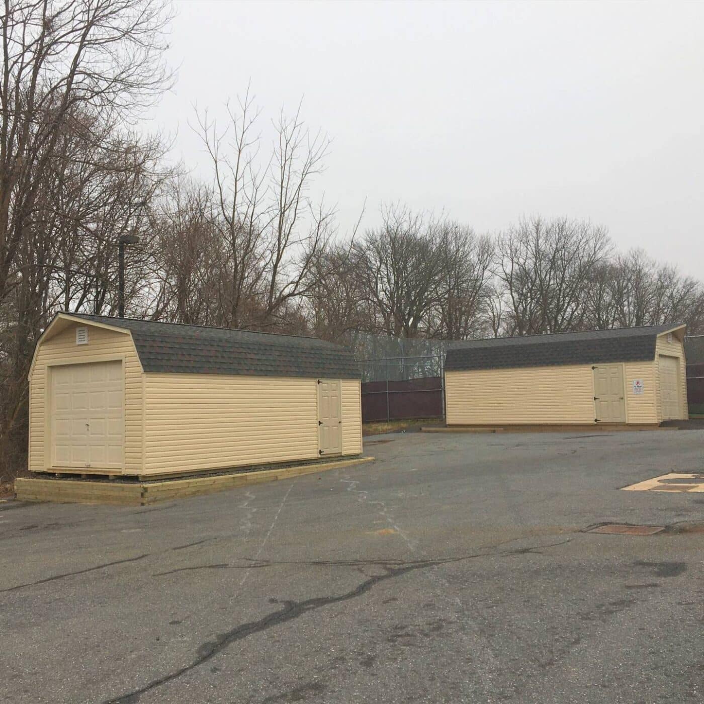 The Standard High Barn Garage 4 High Barn Garage Sheds in parking lot