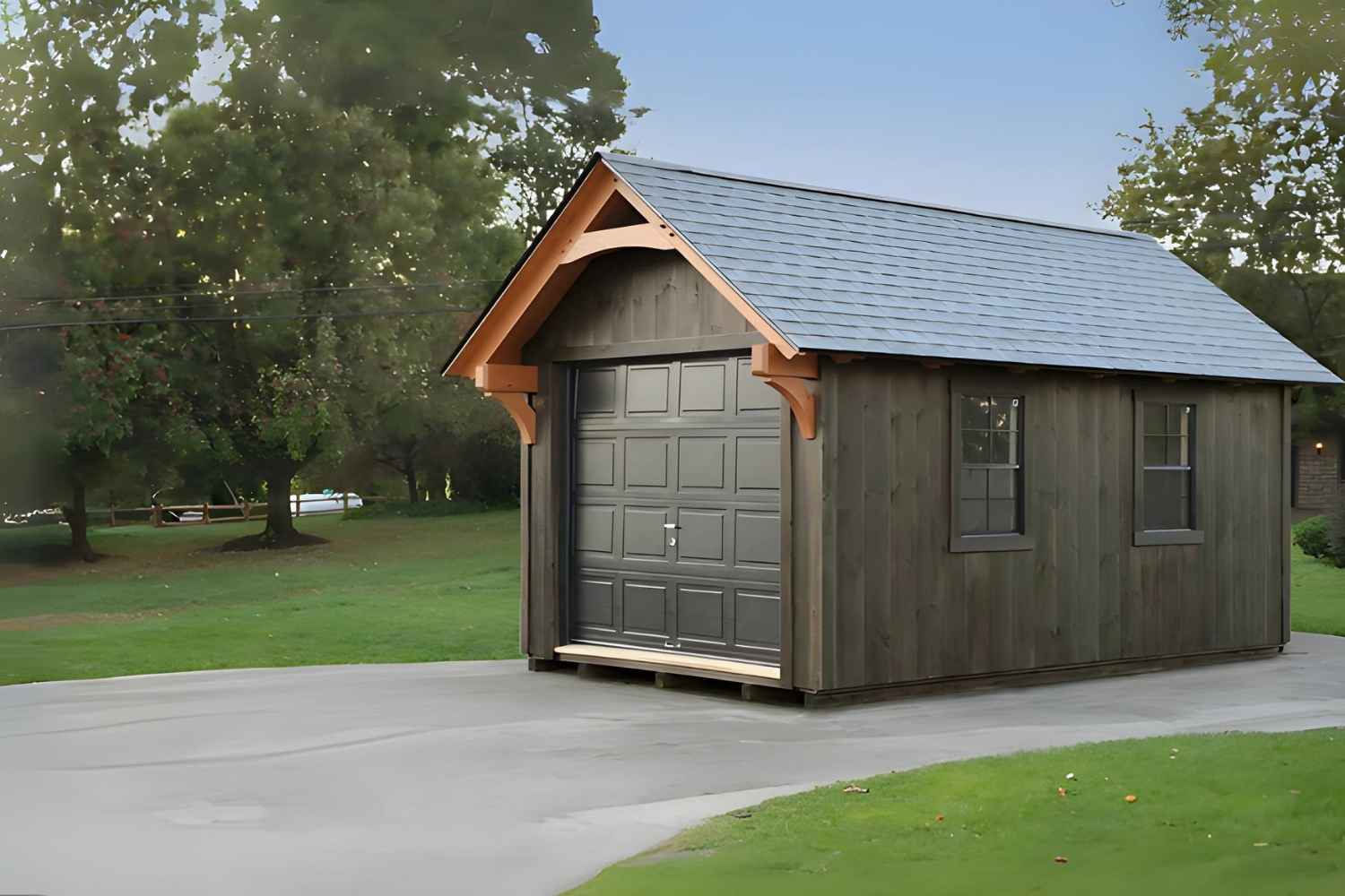 The York Shed 2 The York Shed on driveway with dark gray siding and black garage door