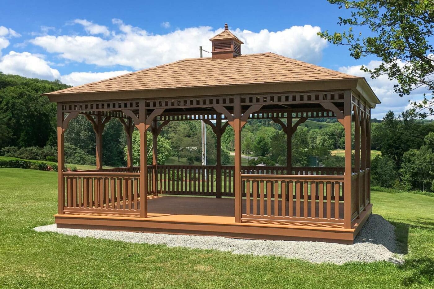 Wood rectangle gazebo with decking on gravel pad with cupola 
