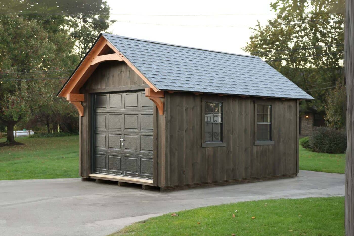 Gray York Timber Frame Shed on driveway with garage door and two side windows